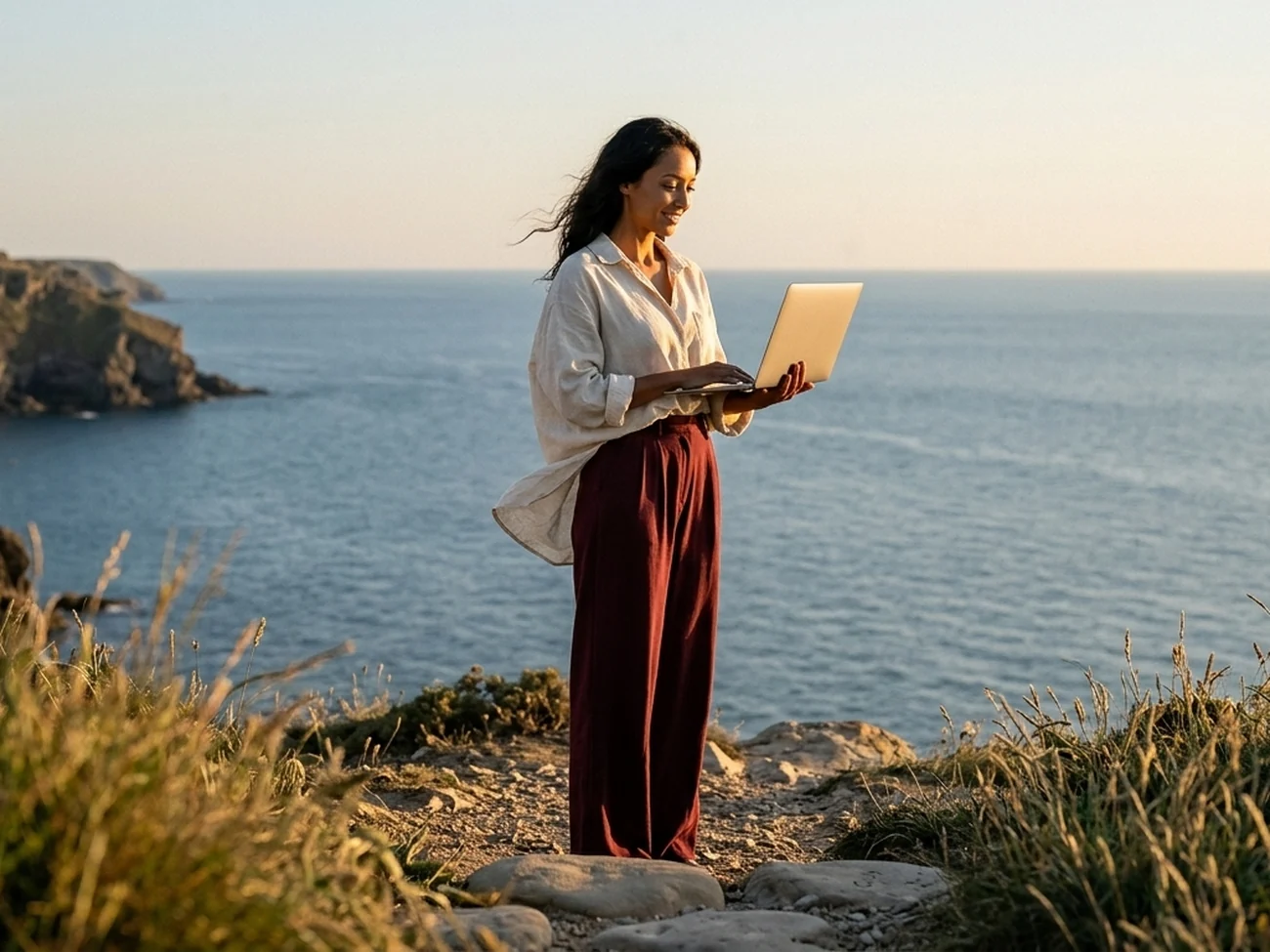 Business owner reviewing how easily visitors can get in touch, on a tablet at golden hour