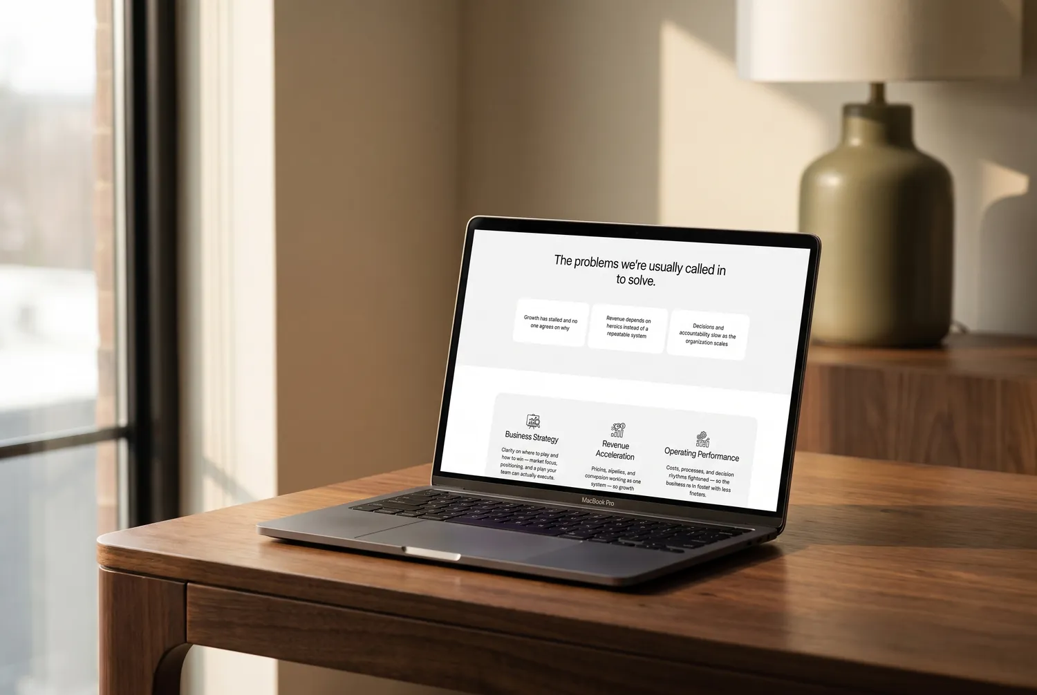 Meridian template services section on a laptop — three cards for Business Strategy, Revenue Acceleration and Operating Performance
